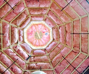 Pink fiberglass insulation in a cathedral ceiling.